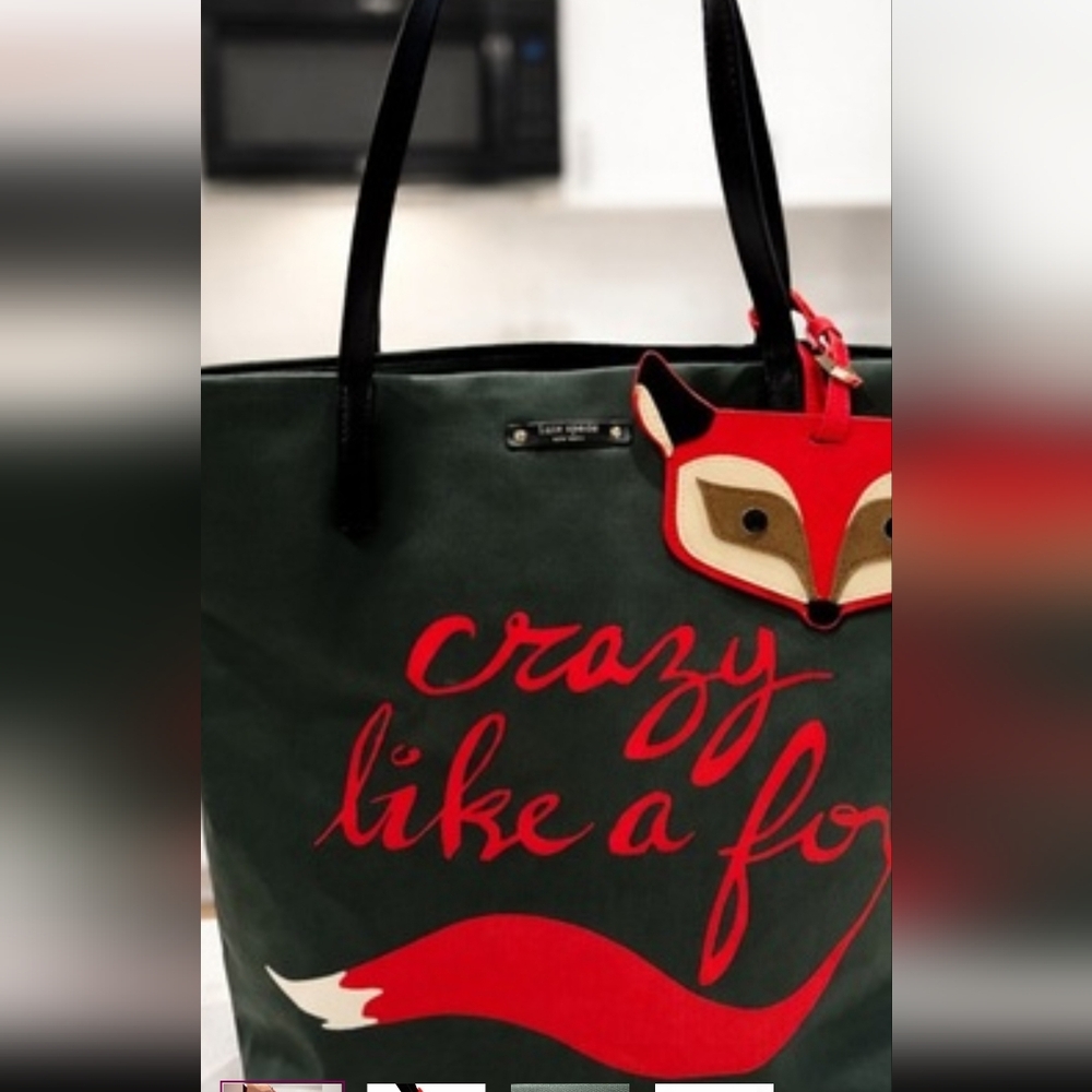 kate spade green canvas tote with red fox charm and script